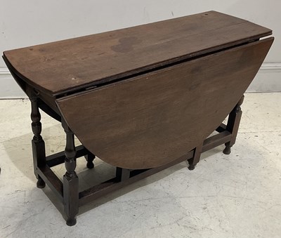 Lot 97 - A 19th century oak drop-leaf gateleg table,...