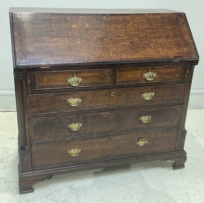 Lot 129 - A 19th century oak bureau, with fitted...