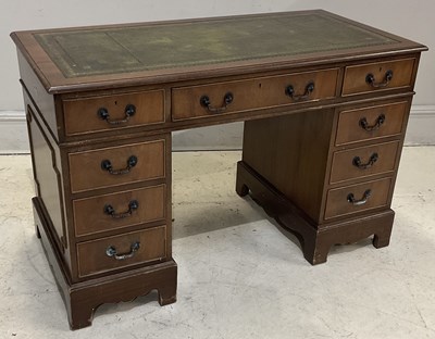 Lot 114 - A reproduction mahogany pedestal desk with an...