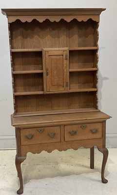 Lot 55 - A reproduction oak dresser, with plate rack...