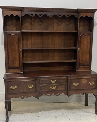Lot 11 - A 20th century George III style oak dresser,...