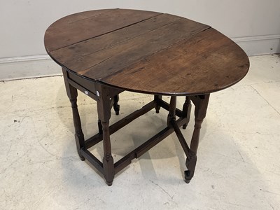 Lot 132 - A 19th century oak drop-leaf gateleg oval...