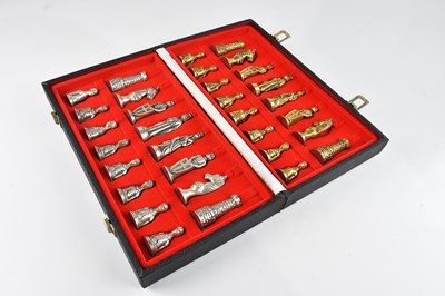 Lot 313 - A boxed brass and stainless steel modern chess...