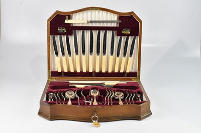 Lot 509 - VINERS; a walnut cased canteen of silver...