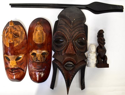 Lot 191 - Three African carved wooden masks, height of...