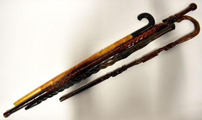 Lot 190 - Four late 20th century African carved walking...