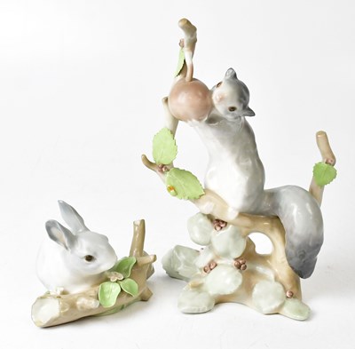 Lot 135 - LLADRO; two models, one of a squirrel nibbling...