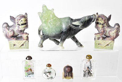 Lot 180 - A carved jade figure of a wise man riding a...