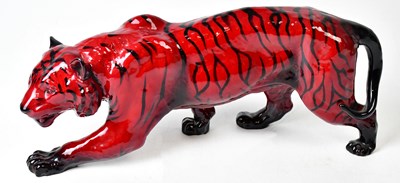 Lot 127 - ROYAL DOULTON; a flambé model of a prowling...