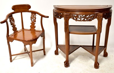 Lot 178 - A Chinese hardwood demi-lune hall table with...
