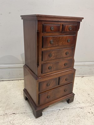 Lot 159 - A reproduction mahogany chest of eight drawers,...