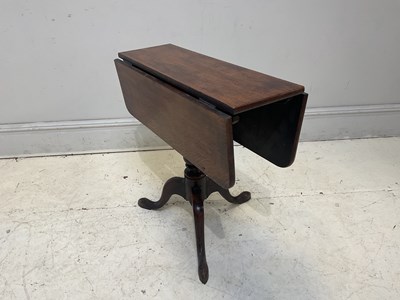 Lot 143 - A 19th century oak drop-leaf tripod table,...