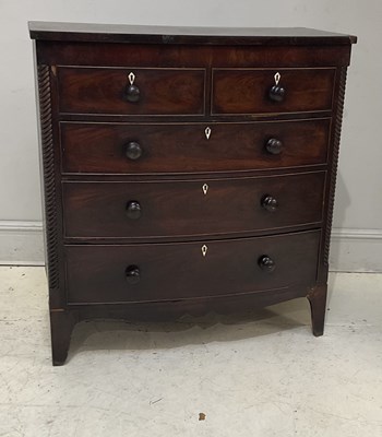 Lot 52 - A 19th century mahogany bowfront chest of two...