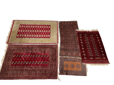Lot 187 - A group of five Eastern style rugs each with...