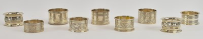 Lot 1169 - Nine assorted hallmarked silver napkin rings,...