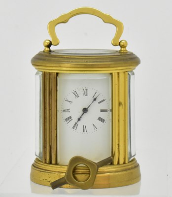 Lot 120 - A small early 20th century brass and glazed...