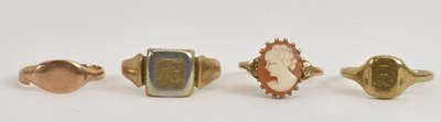 Lot 1254 - Four 9ct yellow gold rings comprising three...