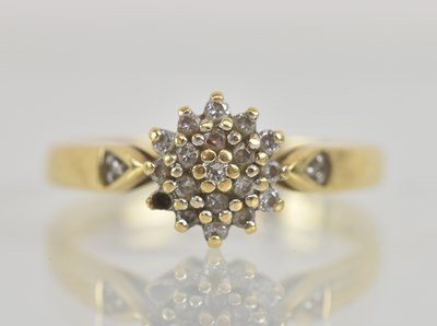 Lot 1272 - An 18ct yellow gold diamond cluster ring,...
