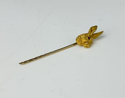 Lot 207 - A yellow metal stickpin with hare's head...