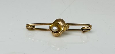 Lot 208 - A yellow metal brooch centred with a conch...