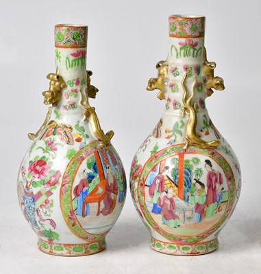 Lot 166 - A pair of Chinese Famille Rose vases of bottle...
