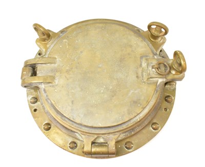 Lot 398 - A large original brass porthole cover with...