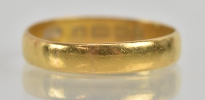 Lot 1229 - A 22ct yellow gold band ring, size P, approx 2....
