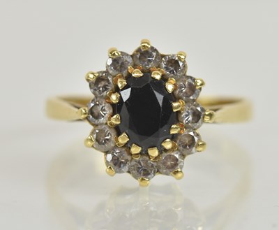 Lot 1274 - An 18ct yellow gold sapphire and white stone...