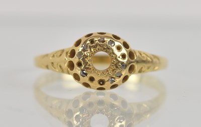Lot 1287 - A yellow metal ring, lacking stone, unmarked,...