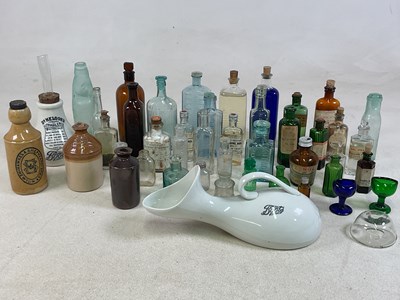Lot 21 - A group of pharmaceutical bottles, also a...
