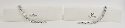 Lot 1415 - SWAROVSKI; two crystal set bracelets with box...