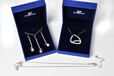 Lot 995 - SWAROVSKI; a boxed earring and pendant set,...