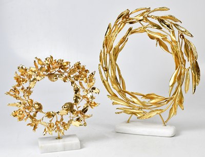 Lot 295 - Two gold-plated wreaths raised on marble...