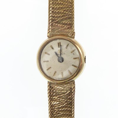 Lot 1101 - OMEGA; a ladies' vintage 9ct gold wristwatch,...