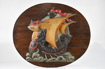 Lot 389 - A 1930s oak panel mounted with an embossed and...