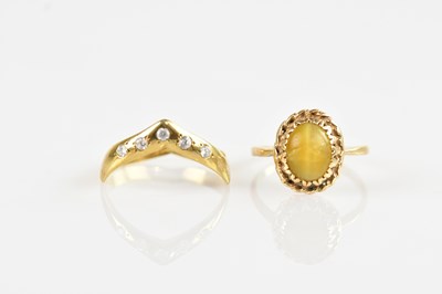 Lot 373 - A 9ct yellow gold wishbone dress ring, set...