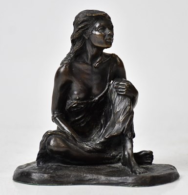 Lot 291 - A small bronze figure of a seated female,...