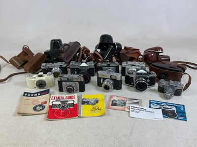 Lot 68 - A quantity of cameras and lenses, including...