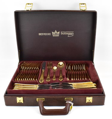 Lot 830 - BESTECKE SOLINGEN; a seventy-piece gold plated...