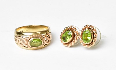 Lot 952 - A 9ct gold ring set with peridot with Celtic...