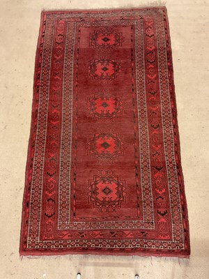 Lot 230 - A Tekke rug, the central rectangular field set...