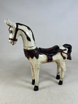 Lot 32 - A small carved wooden figure of a horse,...