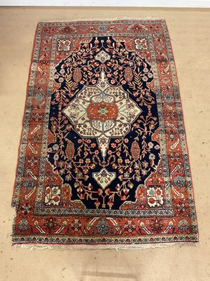 Lot 227 - A Heriz type rug with central cream ground...