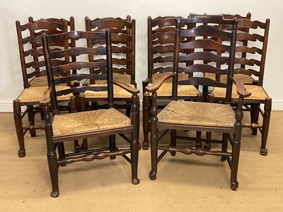 Lot 244 - A harlequin set of ten ladderback rush seated...