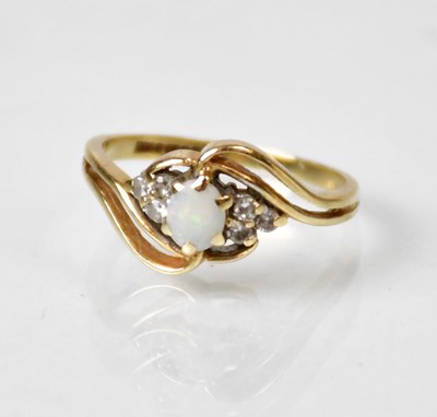 Lot 828 - A 9ct yellow gold ring set with an oval opal...