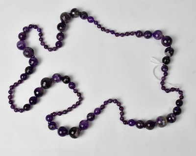 Lot 930 - A faceted bead amber necklace, length 94cm.