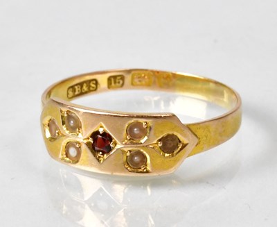 Lot 814 - A 15ct yellow gold ring set with a garnet and...