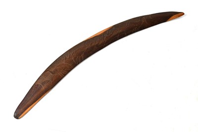 Lot 269 - An Australian Aboriginal boomerang carved with...