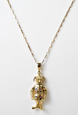 Lot 897 - A 9ct yellow gold articulated pendant in the...