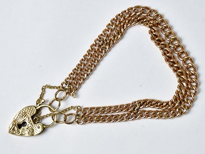 Lot 859 - A 9ct gold double curb link chain bracelet,...